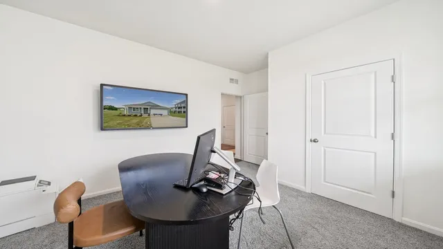 a view of a workspace with furniture