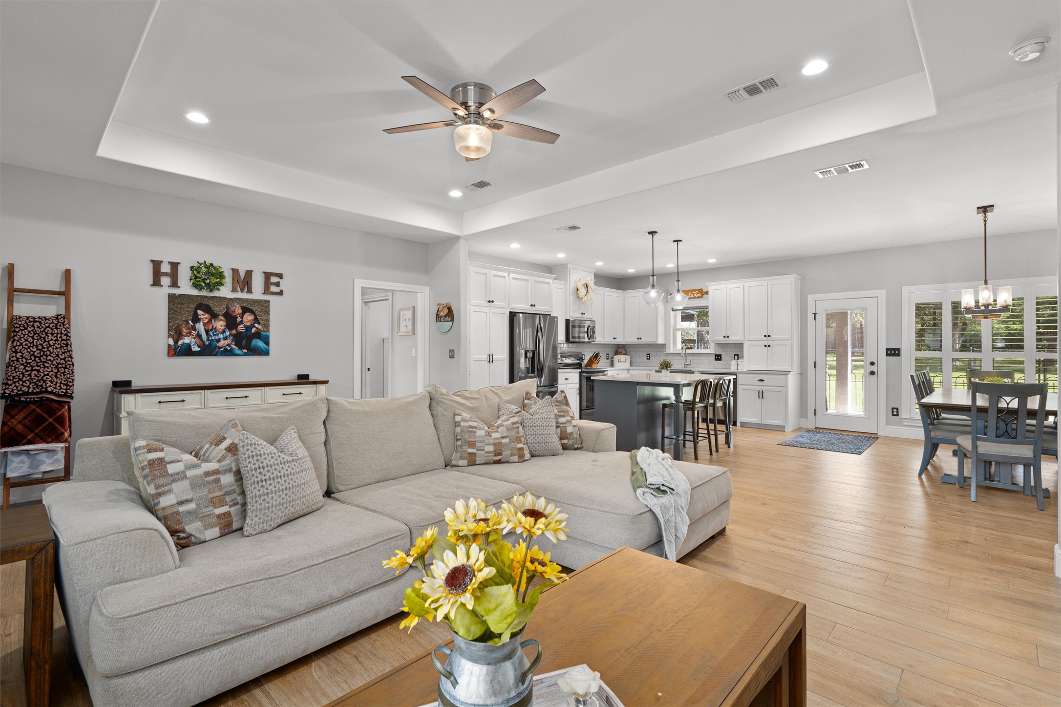 136 Fawn Hollow Elgin, TX 78621 - Photo 8 of 40 Spacious open-concept living area featuring light wood-finish flooring and recessed lighting