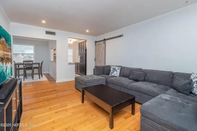 a living room with furniture and a table