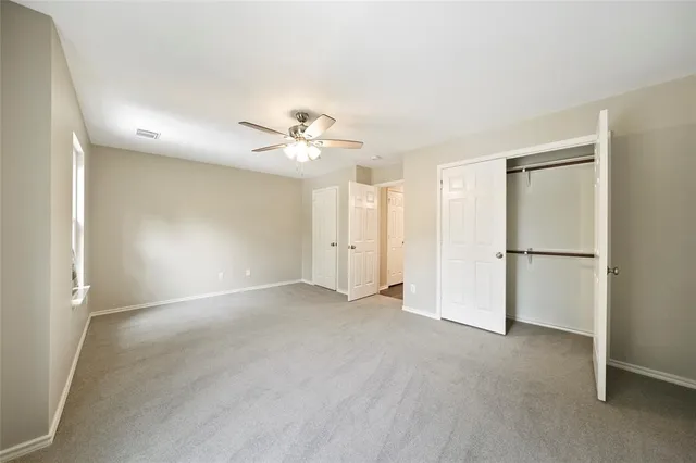 a view of an empty room with a chandelier