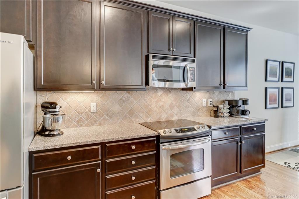 3422 Richard's Crossing Fort Mill, SC 29708 - Photo 14 of 48 a kitchen with granite countertop stainless steel appliances and cabinets