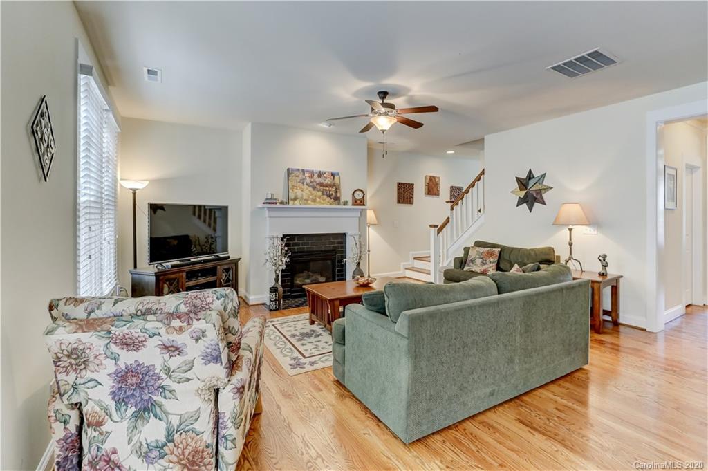 3422 Richard's Crossing Fort Mill, SC 29708 - Photo 20 of 48 a living room with furniture a flat screen tv and a fireplace