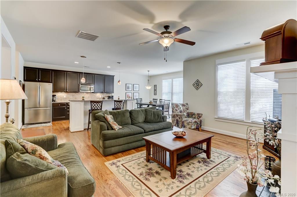 3422 Richard's Crossing Fort Mill, SC 29708 - Photo 22 of 48 a living room with furniture a flat screen tv and kitchen view