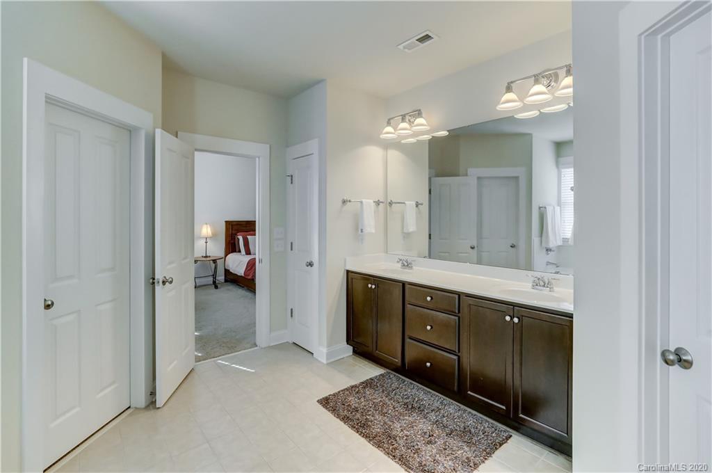 3422 Richard's Crossing Fort Mill, SC 29708 - Photo 28 of 48 a spacious bathroom with a double vanity sink and a mirror