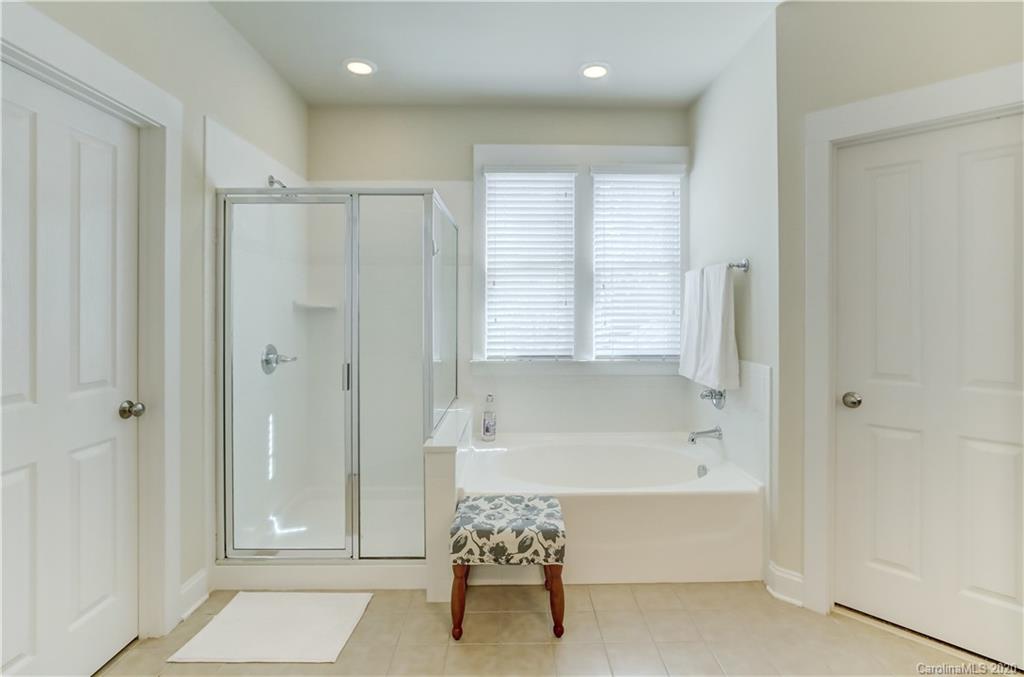 3422 Richard's Crossing Fort Mill, SC 29708 - Photo 29 of 48 a bathroom with a bathtub and a shower