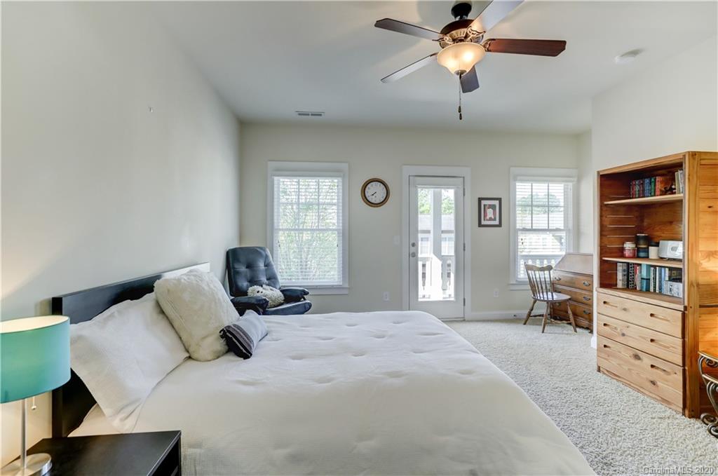 3422 Richard's Crossing Fort Mill, SC 29708 - Photo 30 of 48 a bedroom with a bed and a chandelier