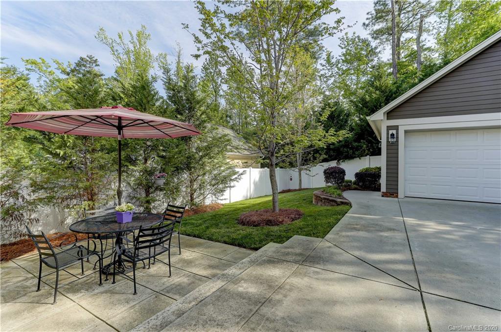 3422 Richard's Crossing Fort Mill, SC 29708 - Photo 41 of 48 a patio with a table and chairs under an umbrella