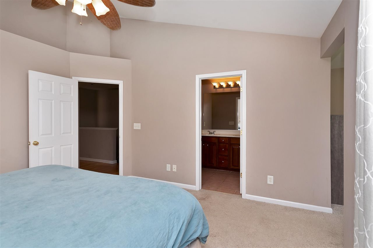3370 Bridgeville Road Raleigh, NC 27610 - Photo 20 of 30 Beyond the cathedral ceiling and ceiling fan are the entries to the master bath/spa and huge walk-in closet. Master Suite