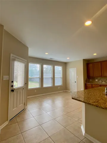 a view of a kitchen with a sink and a window