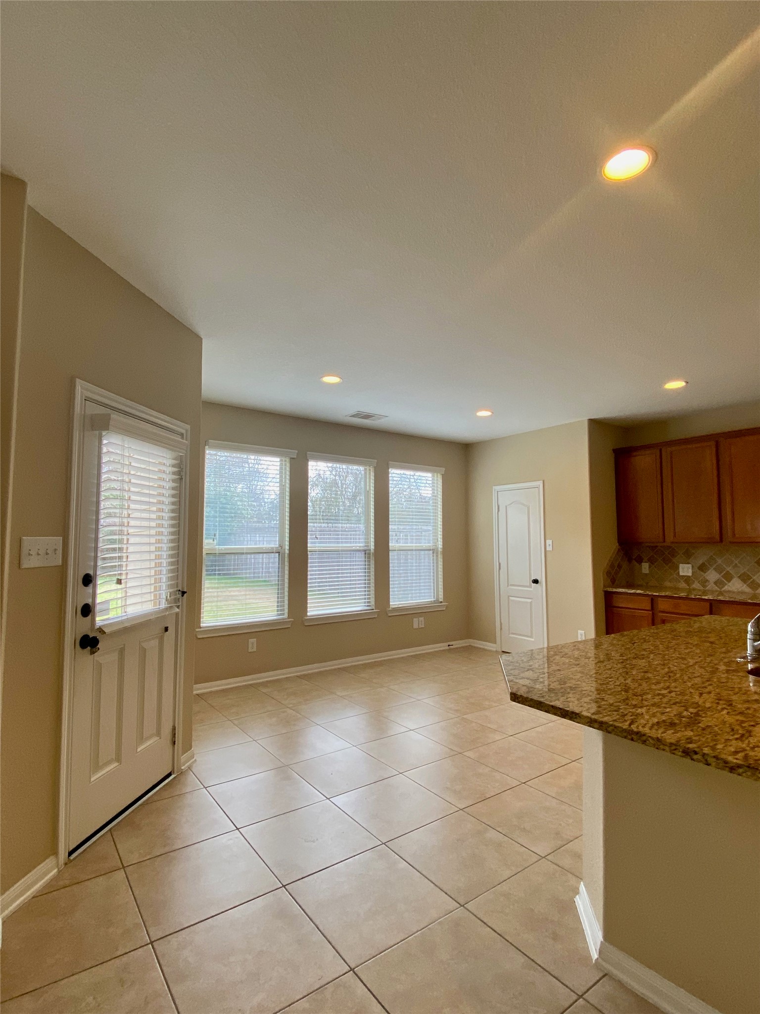 15 Sagamore Ridge Place The Woodlands, TX 77389 - Photo 12 of 39 a view of a kitchen with a sink and cabinets