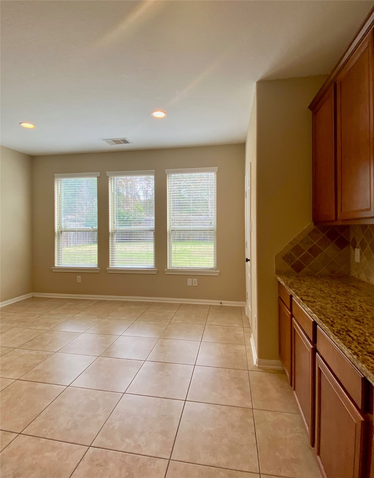 15 Sagamore Ridge Place The Woodlands, TX 77389 - Photo 13 of 39 a view of a kitchen with a sink and a window