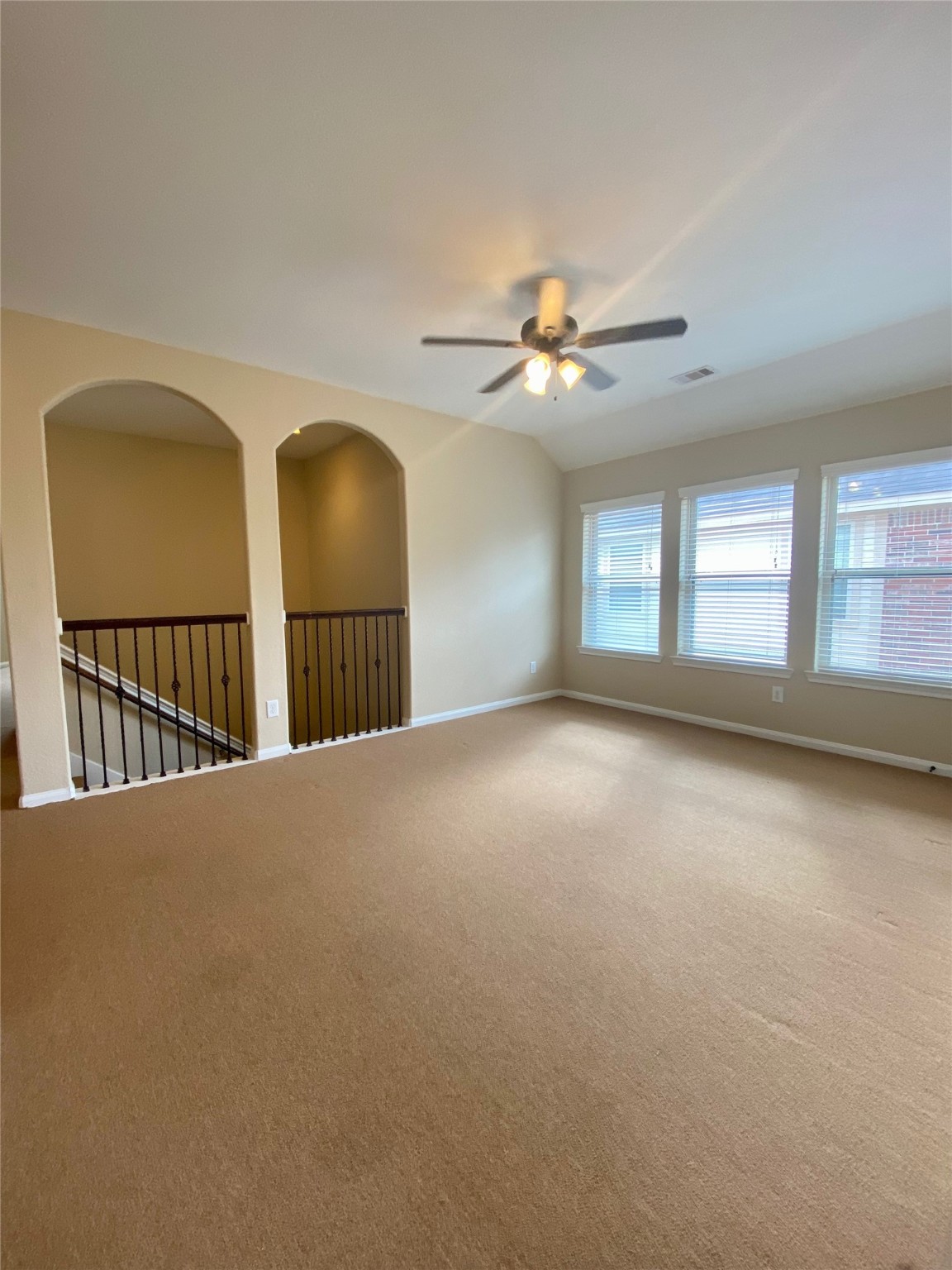 15 Sagamore Ridge Place The Woodlands, TX 77389 - Photo 24 of 39 a view of a livingroom with a ceiling fan and window