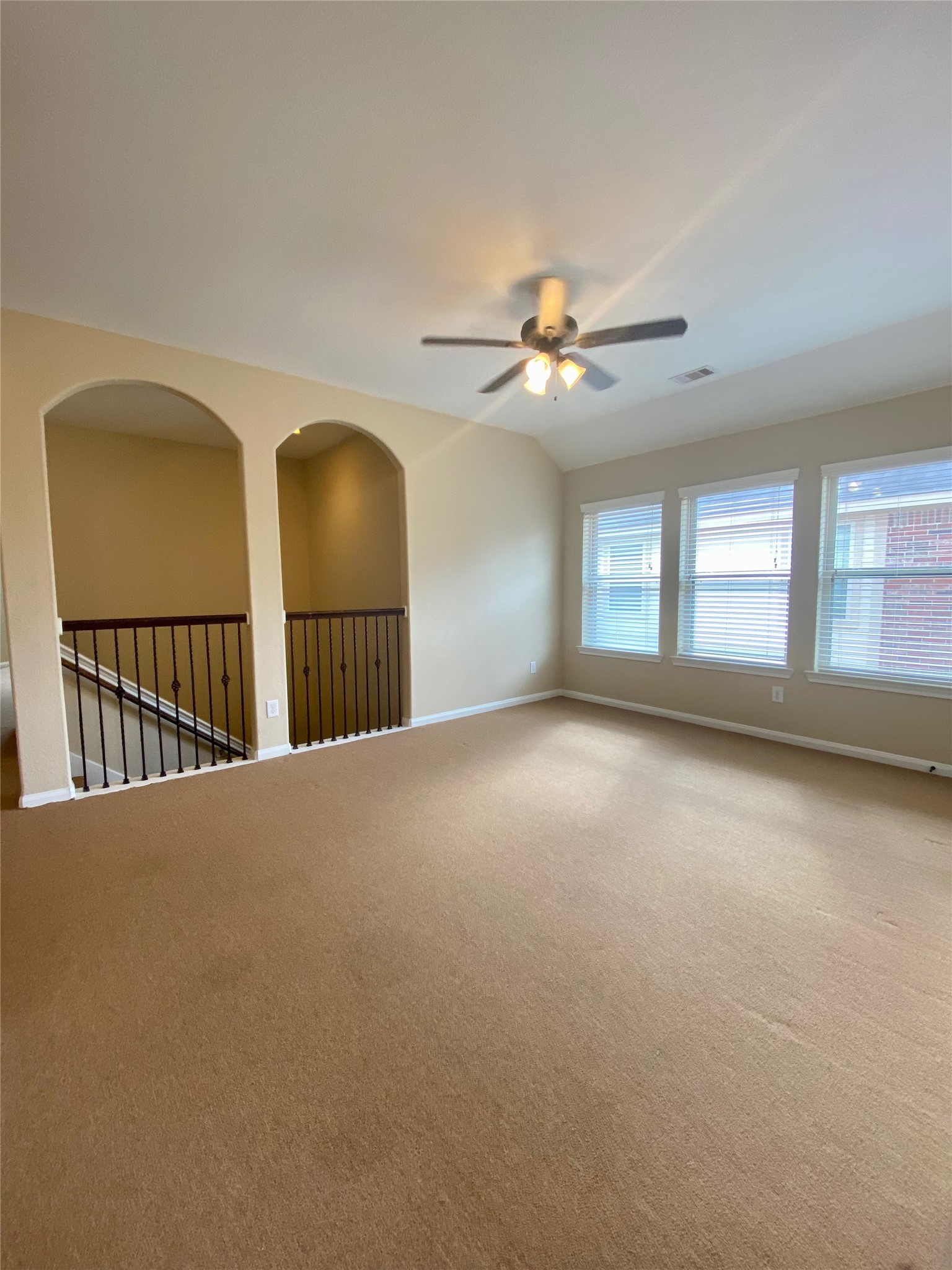 15 Sagamore Ridge Place The Woodlands, TX 77389 - Photo 24 of 39 a view of a livingroom with a ceiling fan and window