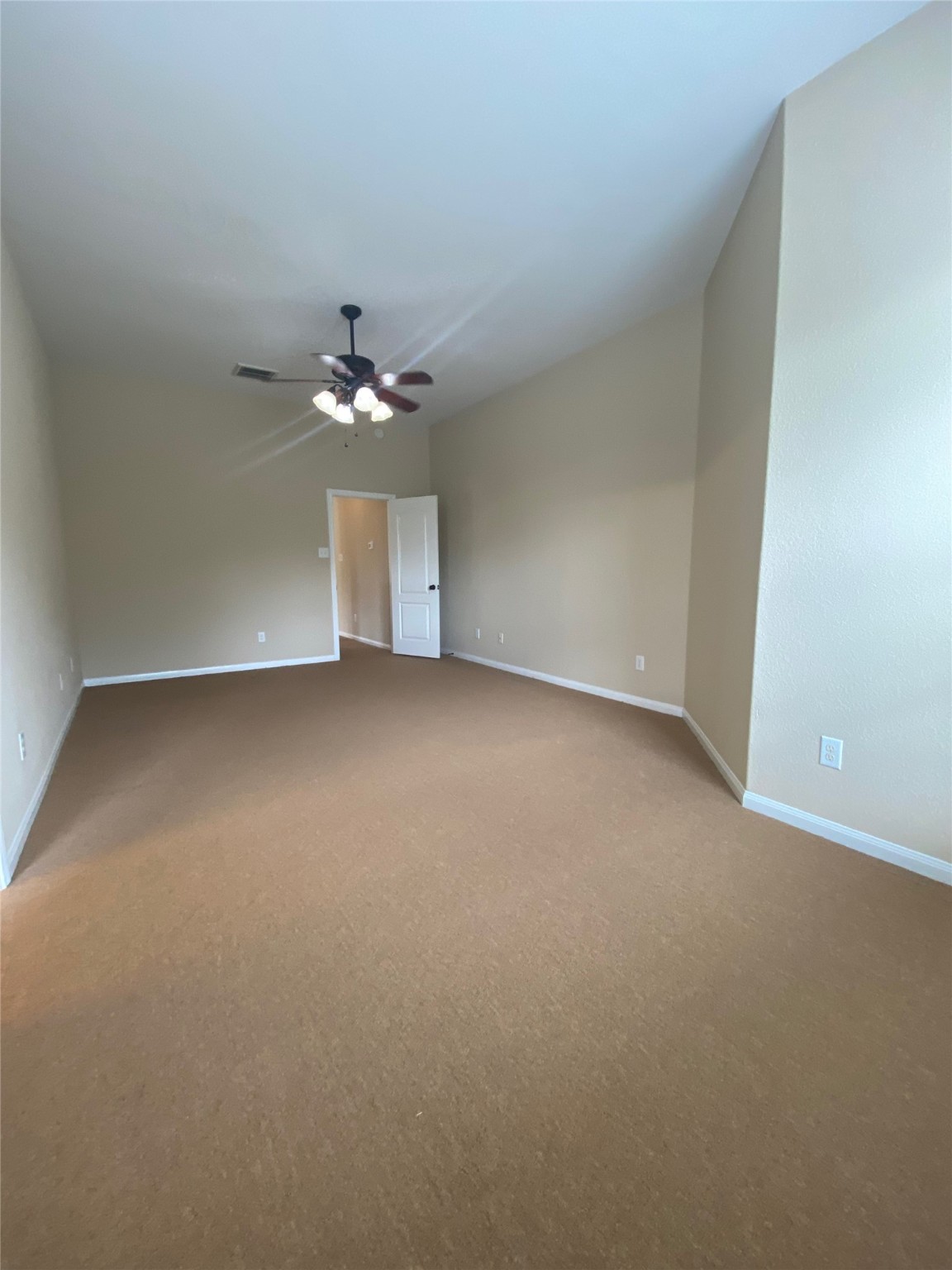 15 Sagamore Ridge Place The Woodlands, TX 77389 - Photo 27 of 39 an empty room with a ceiling fan and a window