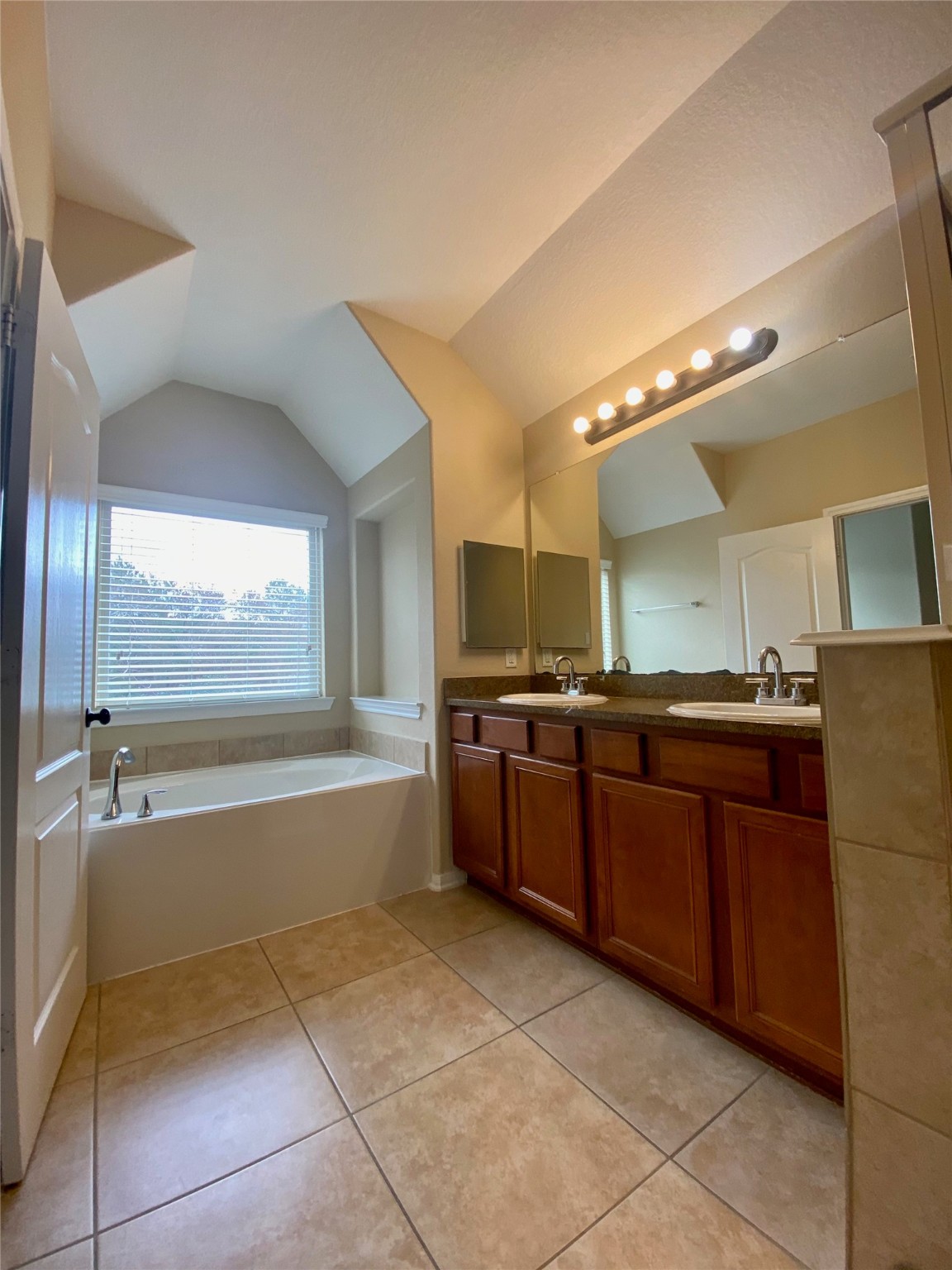 15 Sagamore Ridge Place The Woodlands, TX 77389 - Photo 28 of 39 a large bathroom with a large tub and sink