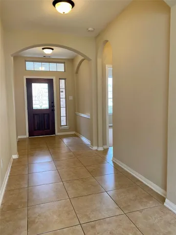 a view of a hallway with front door