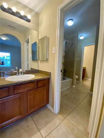 a bathroom with a toilet and shower