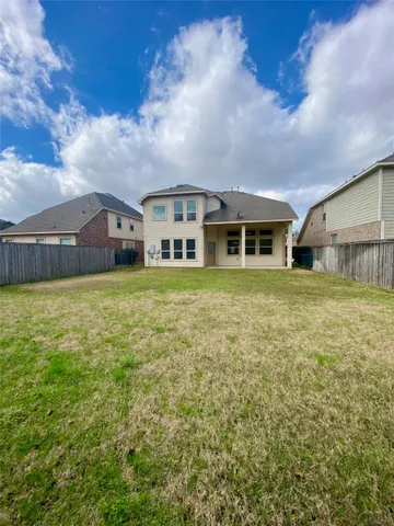a view of a swimming pool and mountains in the background