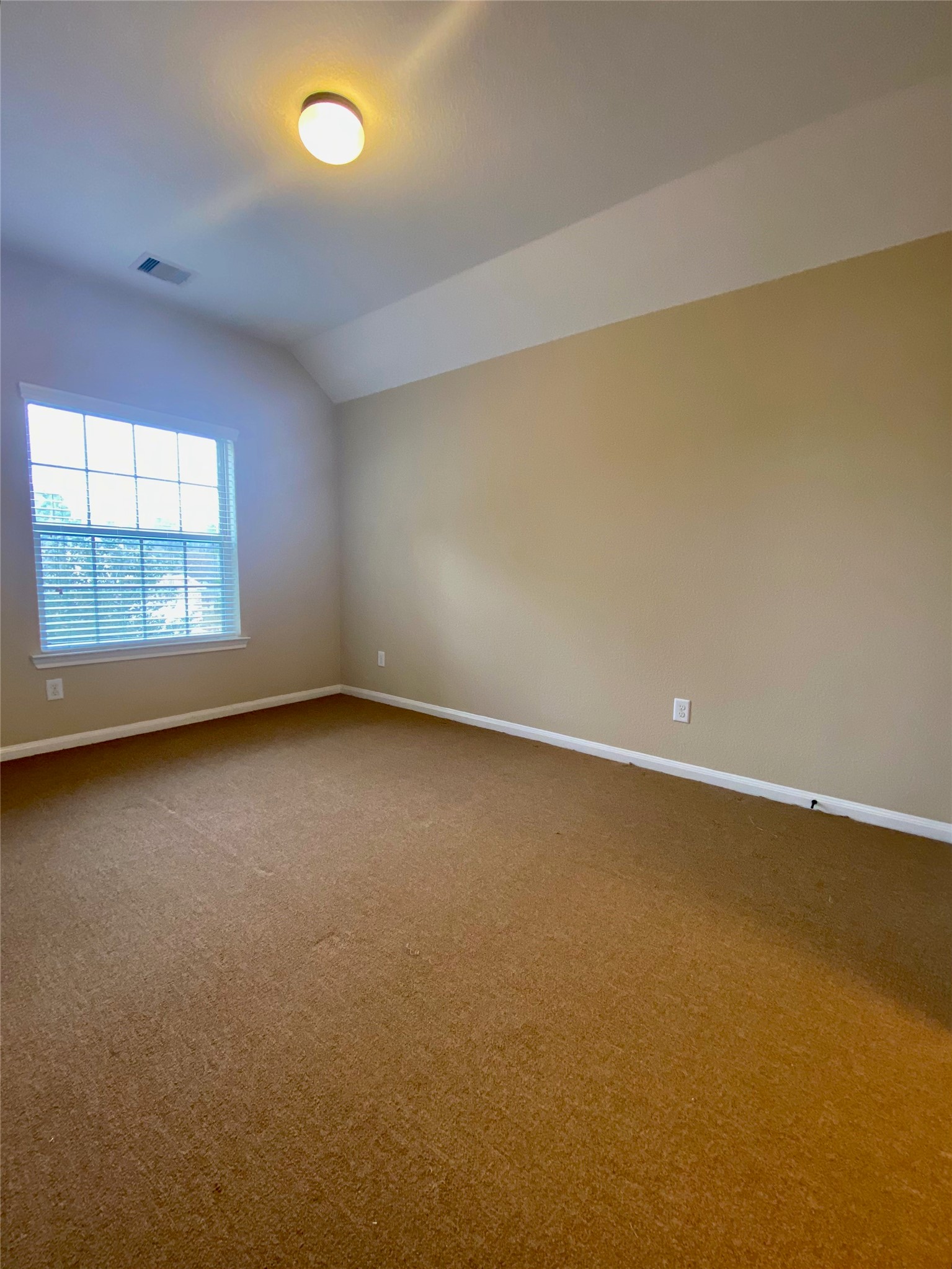 15 Sagamore Ridge Place The Woodlands, TX 77389 - Photo 4 of 39 an empty room with a window
