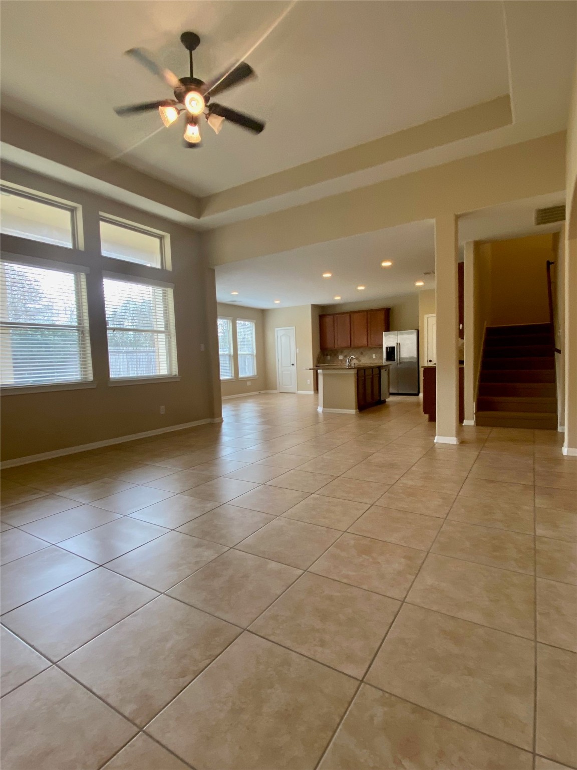 15 Sagamore Ridge Place The Woodlands, TX 77389 - Photo 9 of 39 a view of a livingroom with a ceiling fan and window