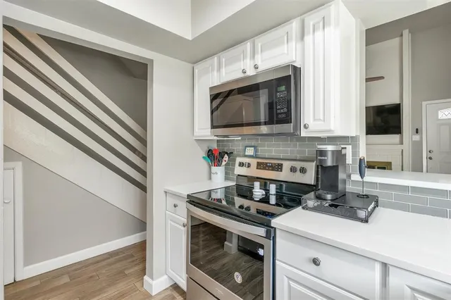 a kitchen with a stove and a microwave