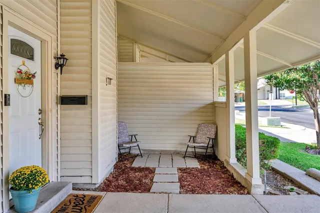 a view of a porch with a bench
