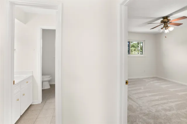 a view of an empty room with a bathroom