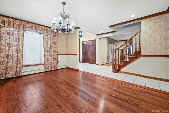a view of an entryway with wooden floor
