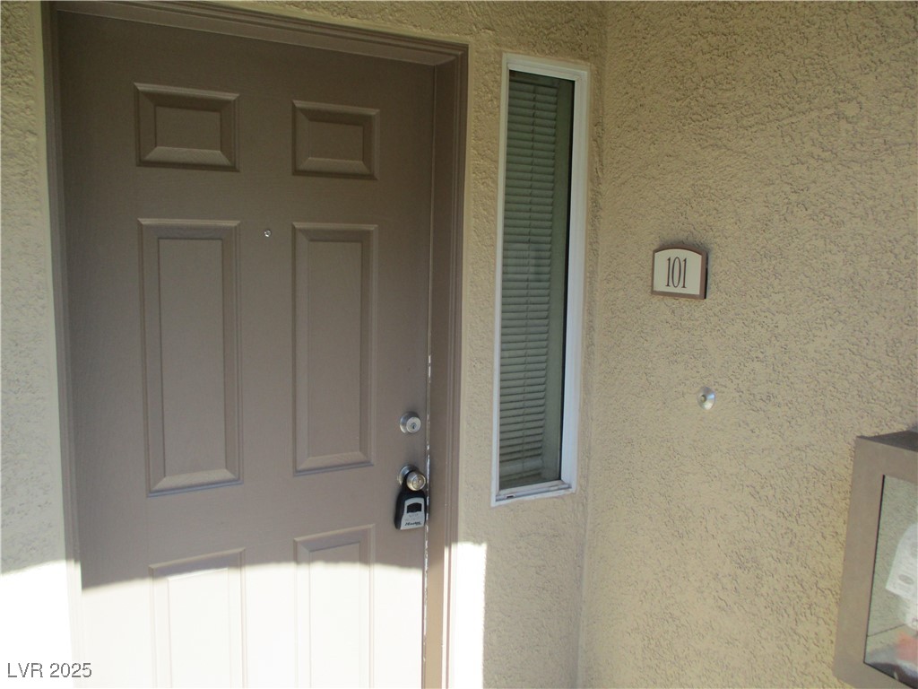 3500 Cactus Shadow Street, Unit 101 Las Vegas, NV 89129 - Photo 3 of 4 Entrance to property with stucco siding