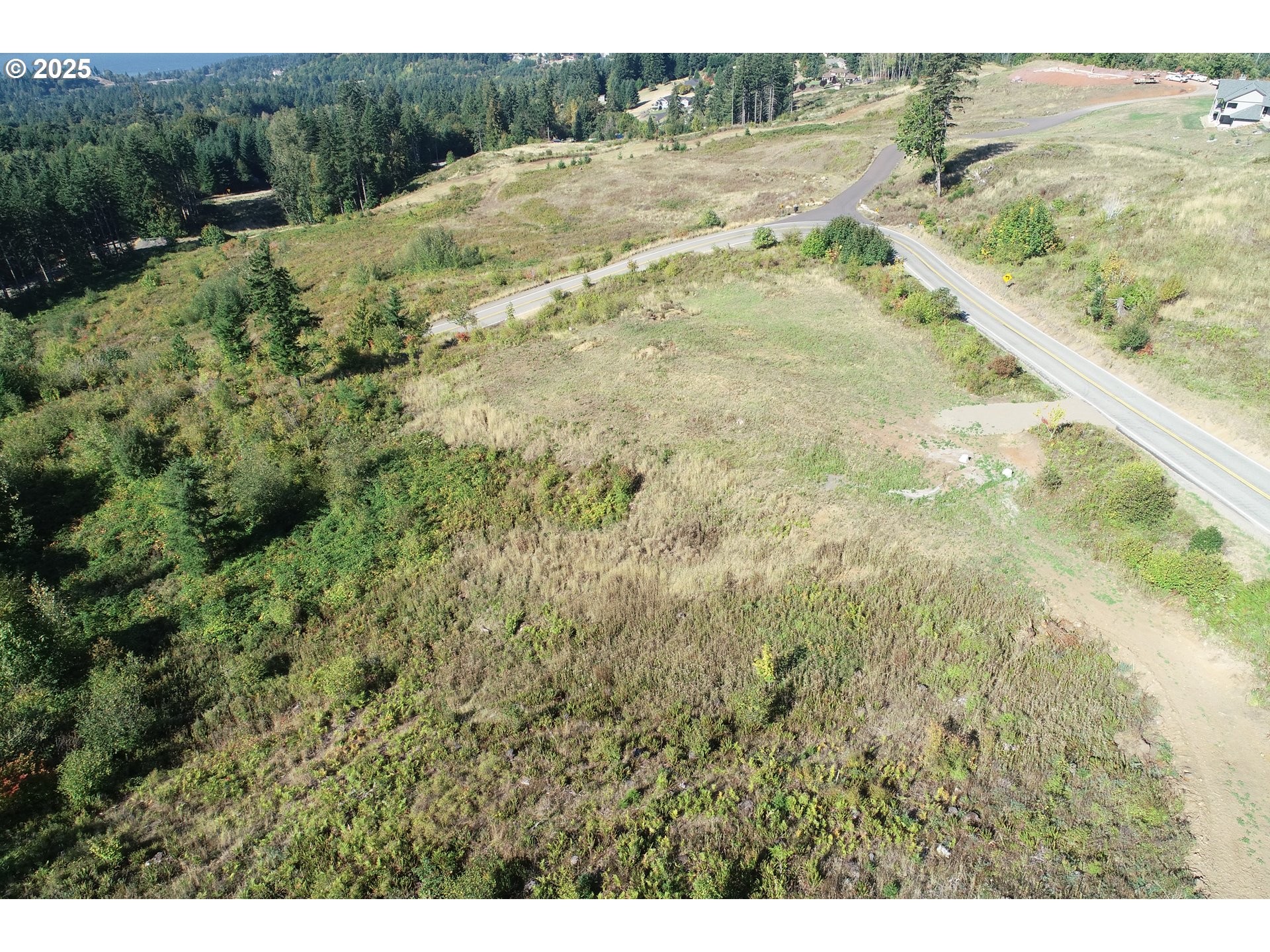 4130 Green Mountain Road, Unit 1 Kalama, WA 98625 - Photo 7 of 13 a view of a field of grass and trees