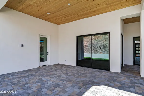 a view of an entrance of house and a yard
