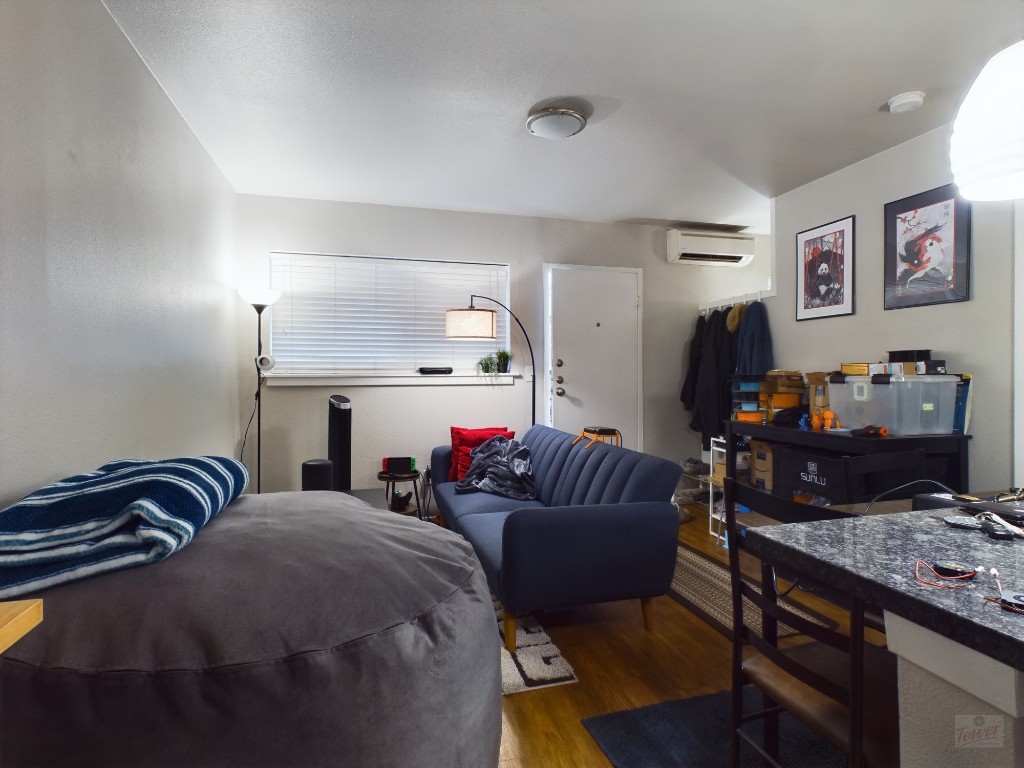 304 East 33rd Street, Unit 8 Austin, TX 78705 - Photo 7 of 14 a living room with furniture fireplace and a window