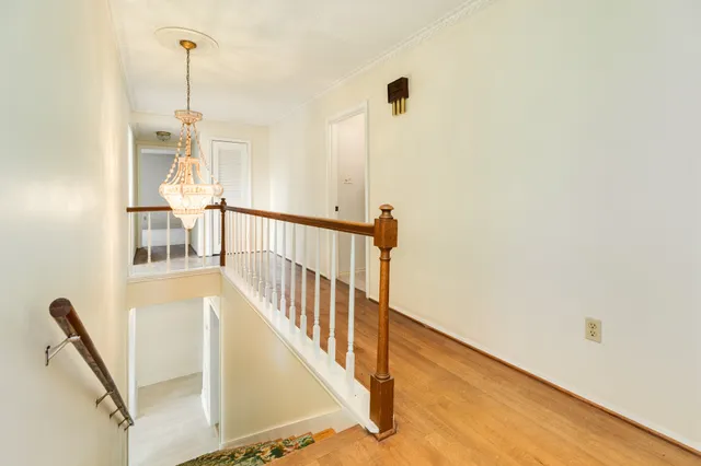 a view of a hallway with windows