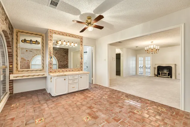a large spacious bathroom with a large tub and sink