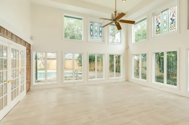a view of an entryway with a floor to ceiling window