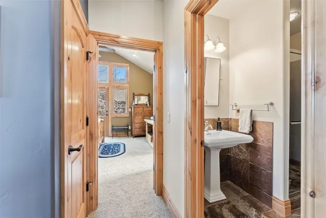 a view of a bathroom with a tub shower and a sink