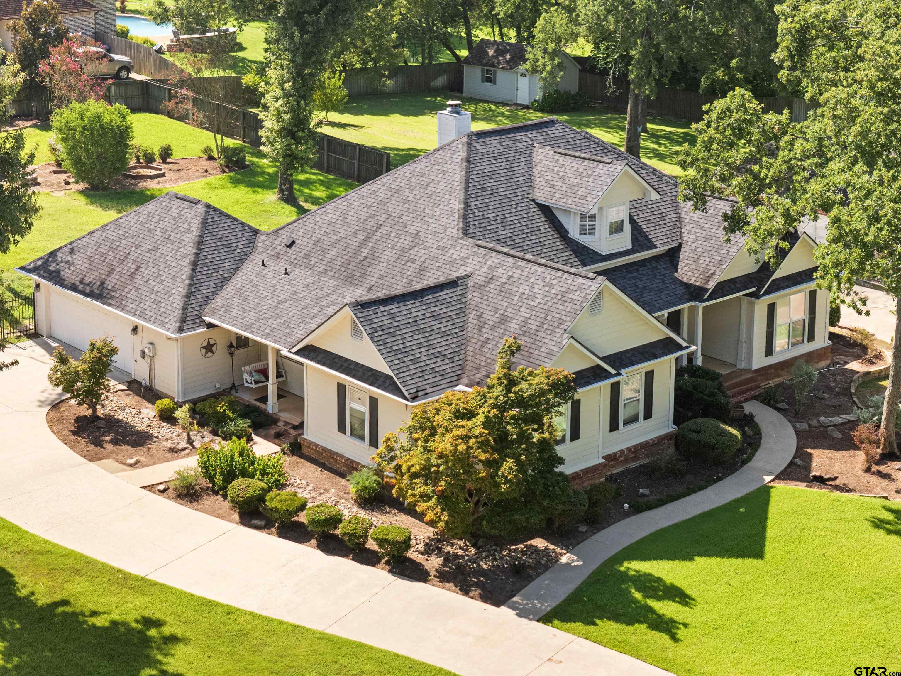 5201 Whitaker Circle Longview, TX 75605 - Photo 1 of 40 a aerial view of a house with swimming pool garden and patio