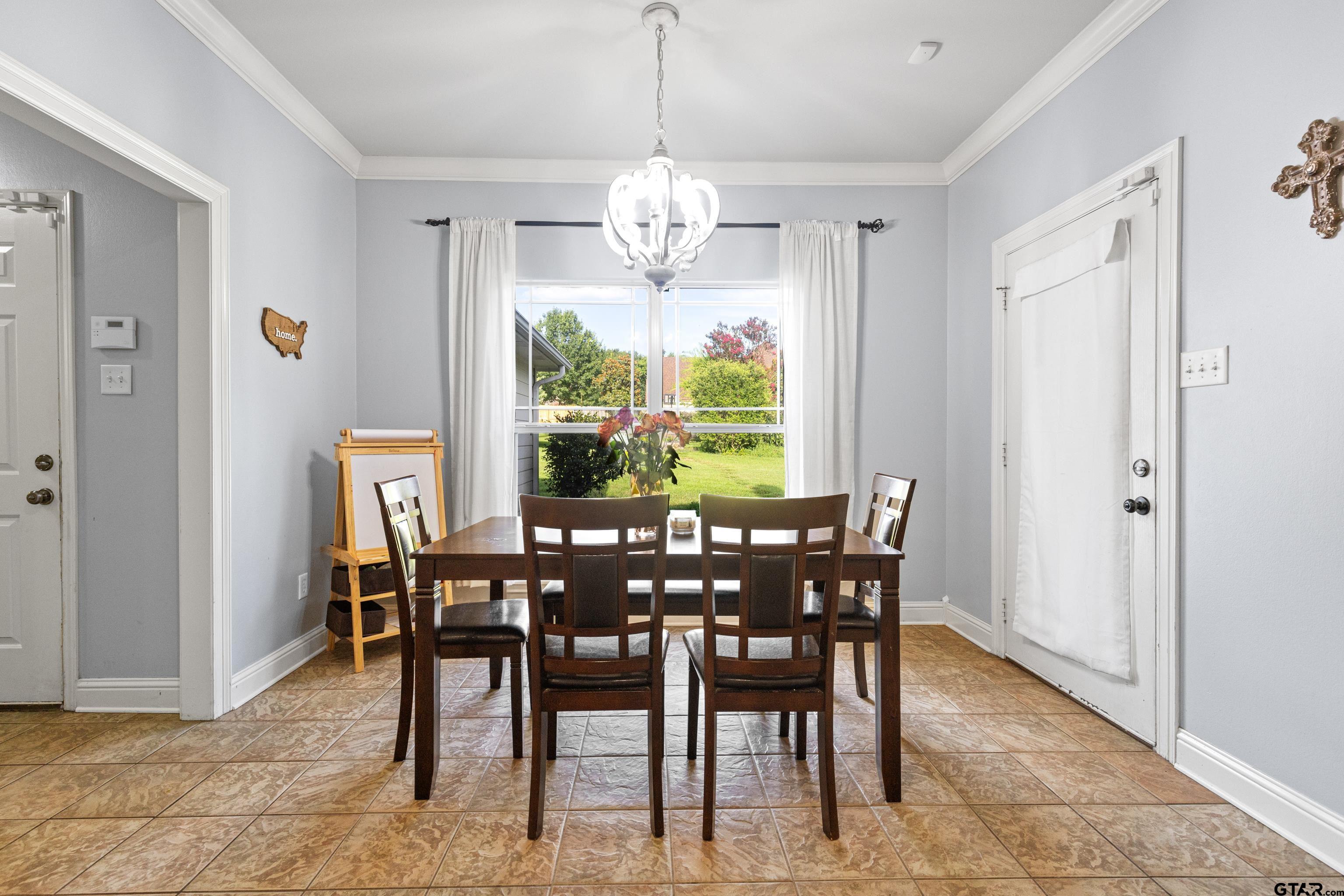 5201 Whitaker Circle Longview, TX 75605 - Photo 11 of 40 a view of a dining room with furniture window and outside view