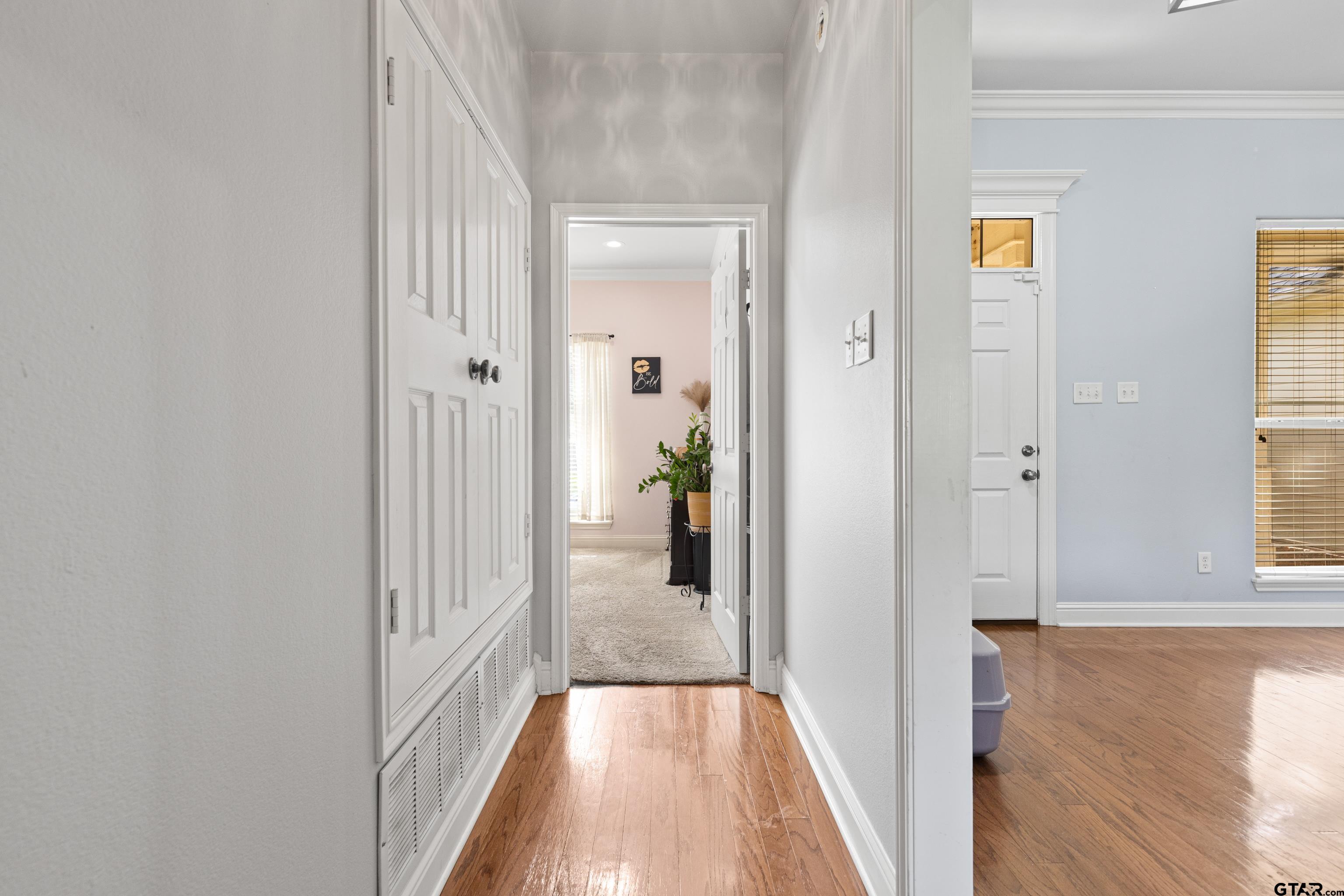 5201 Whitaker Circle Longview, TX 75605 - Photo 18 of 40 a view of a hallway with wooden floor and windows