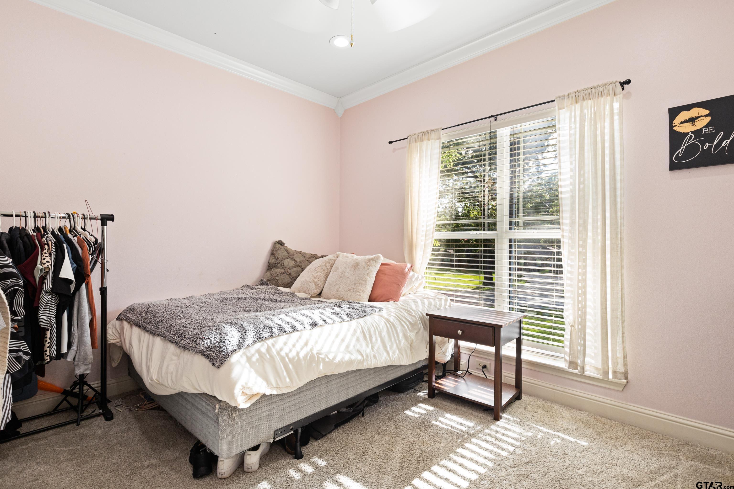 5201 Whitaker Circle Longview, TX 75605 - Photo 19 of 40 a large bed sitting in a bedroom next to a window