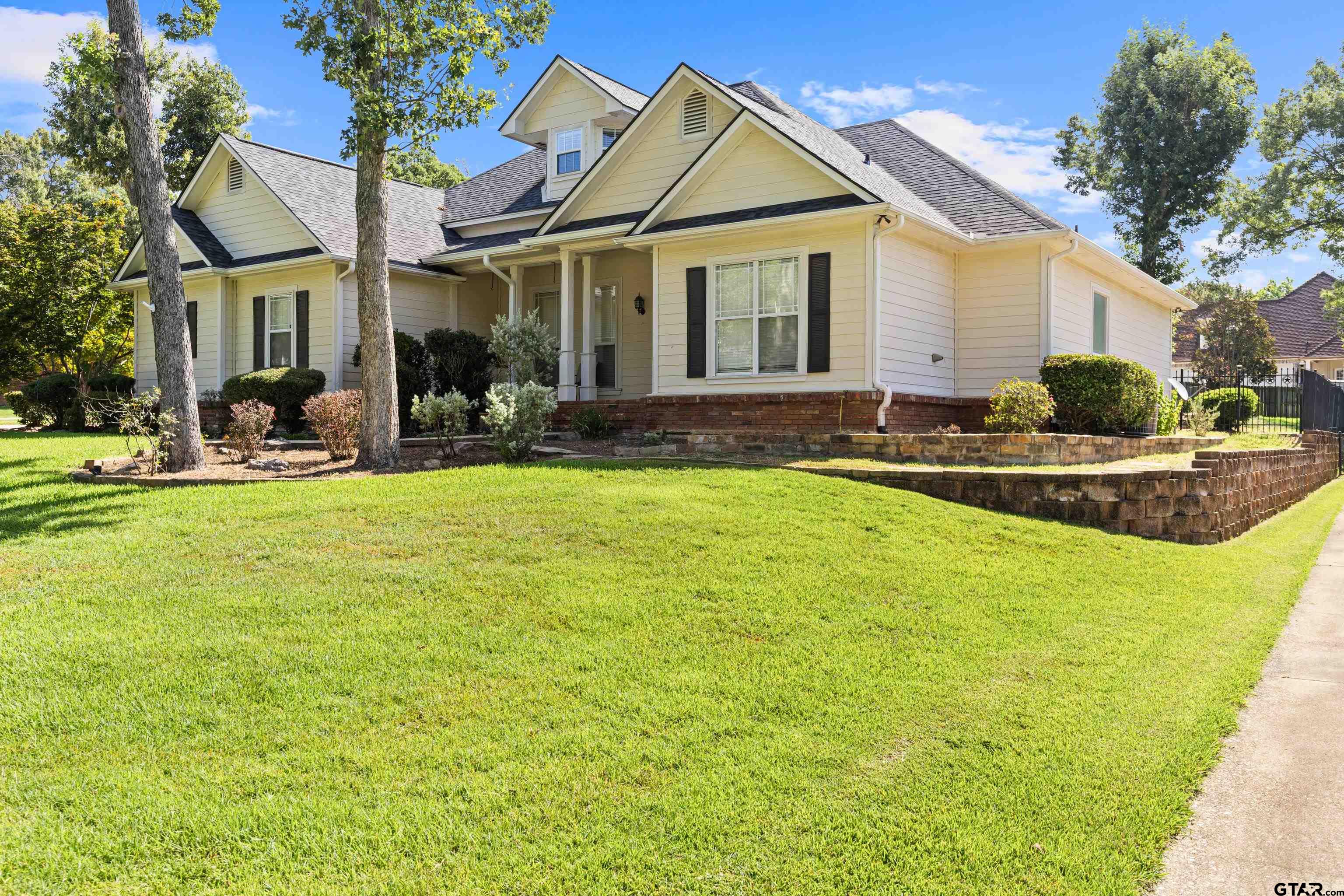 5201 Whitaker Circle Longview, TX 75605 - Photo 2 of 40 a view of a house with a yard patio and swimming pool