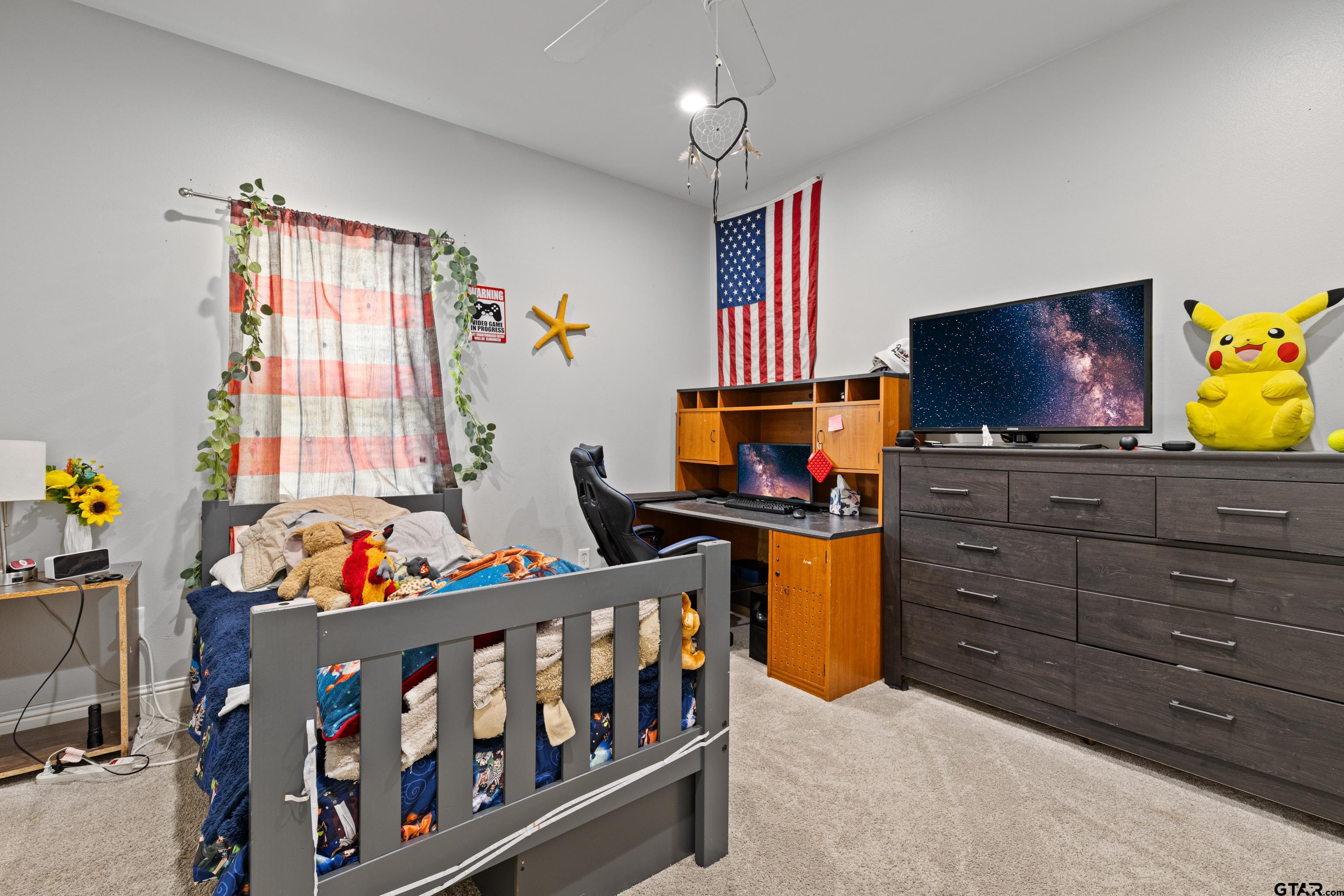 5201 Whitaker Circle Longview, TX 75605 - Photo 22 of 40 a bedroom with furniture and a flat screen tv