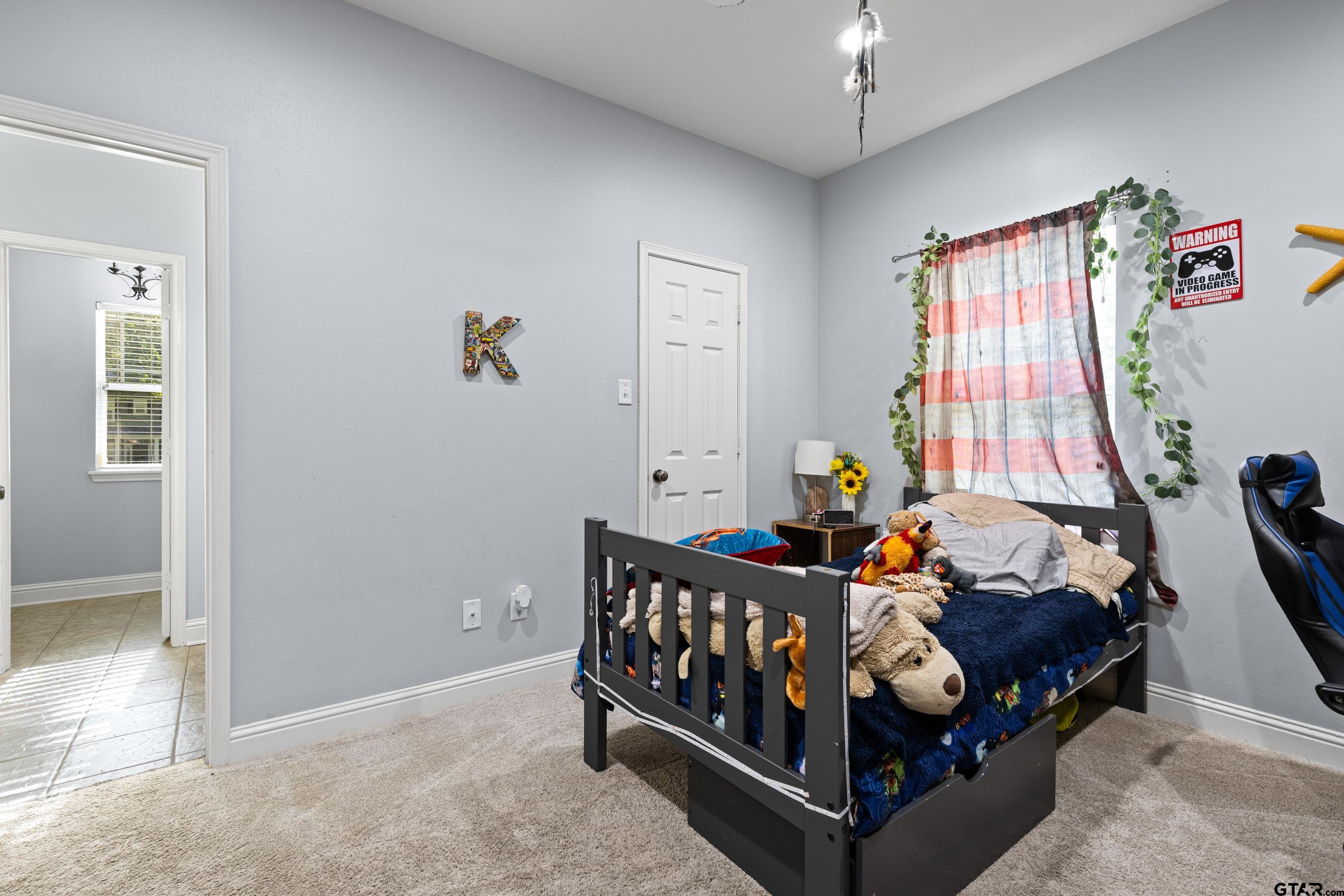 5201 Whitaker Circle Longview, TX 75605 - Photo 23 of 40 a bed room with furniture and a window