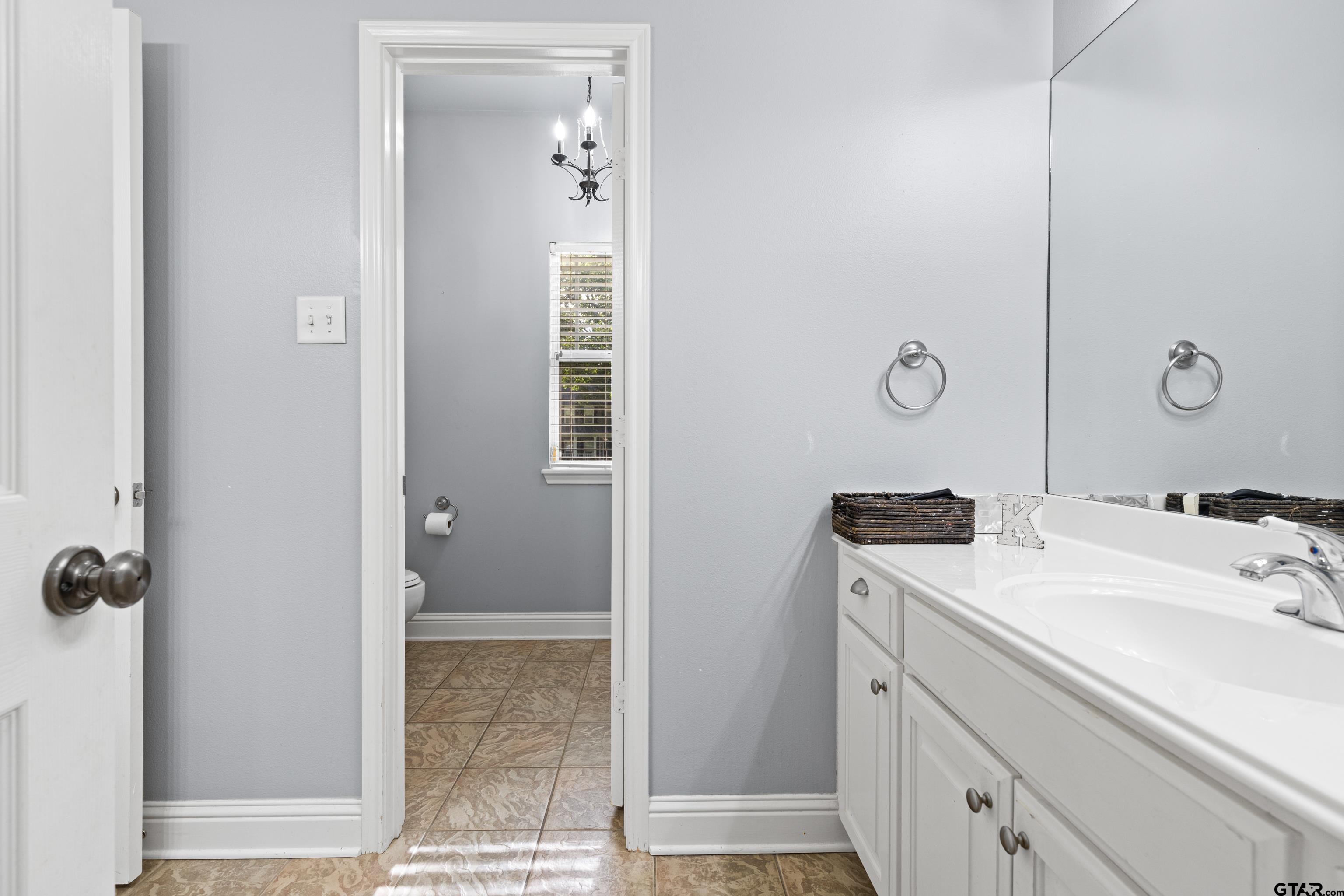 5201 Whitaker Circle Longview, TX 75605 - Photo 24 of 40 a bathroom with a sink and mirror
