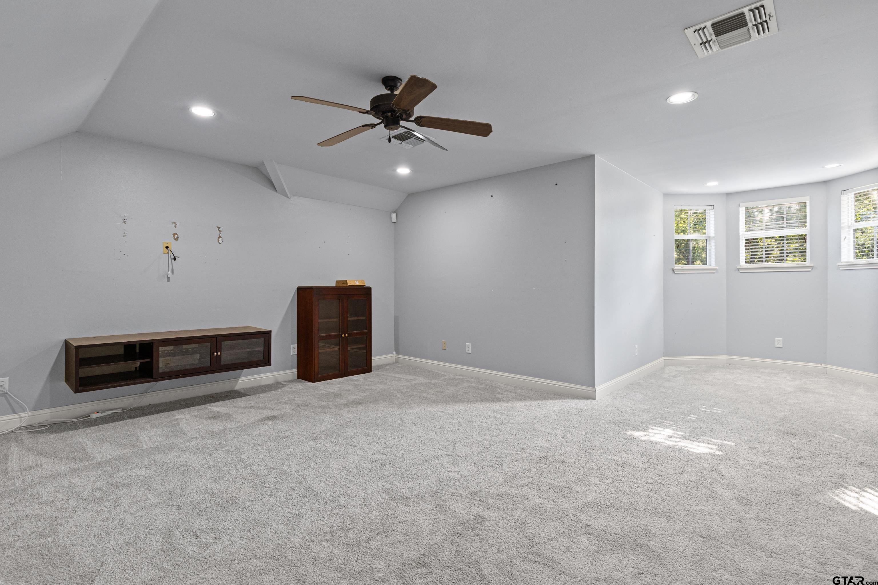 5201 Whitaker Circle Longview, TX 75605 - Photo 32 of 40 an empty room with windows and fan