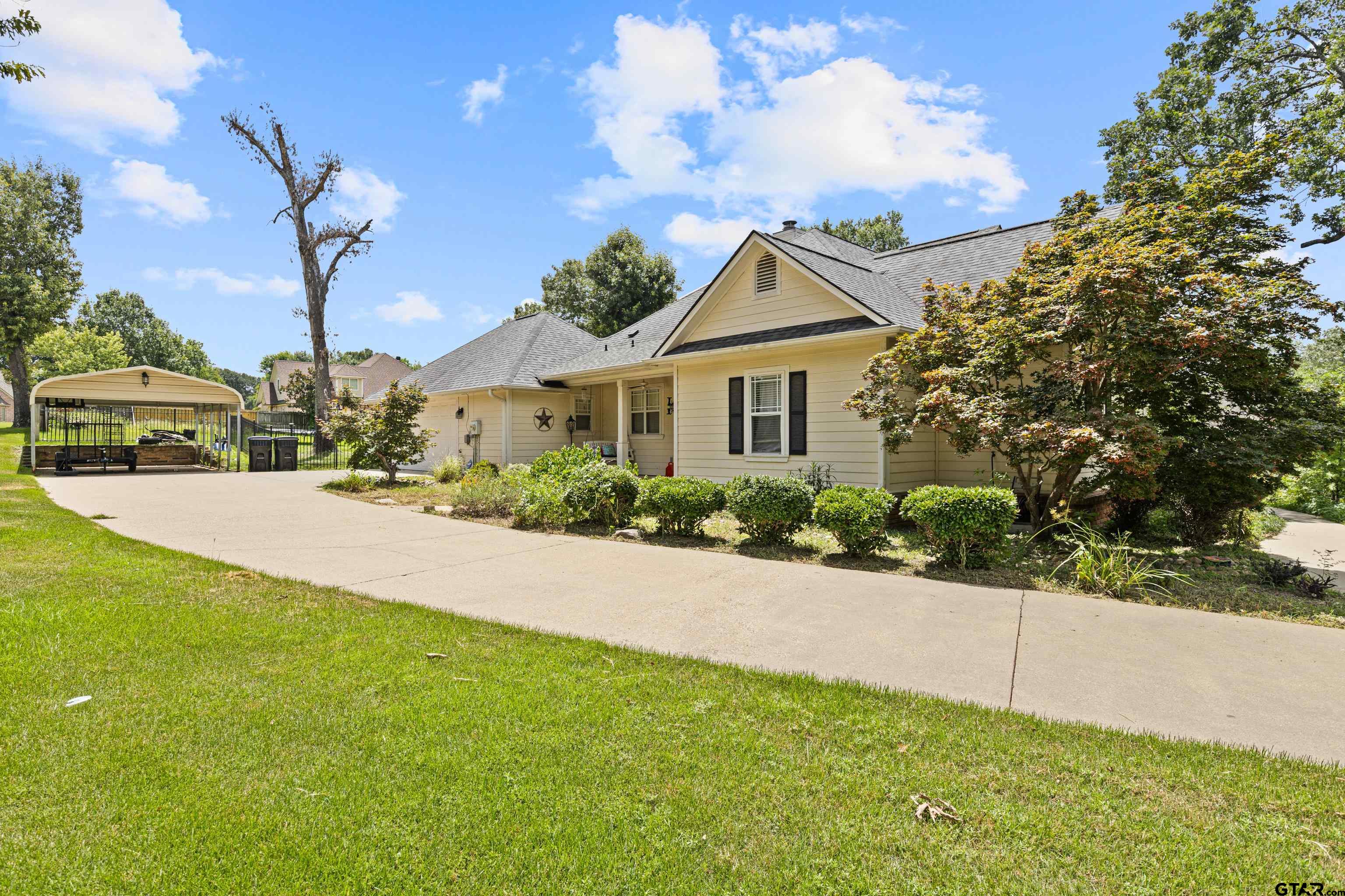 5201 Whitaker Circle Longview, TX 75605 - Photo 35 of 40 a front view of a house with a yard