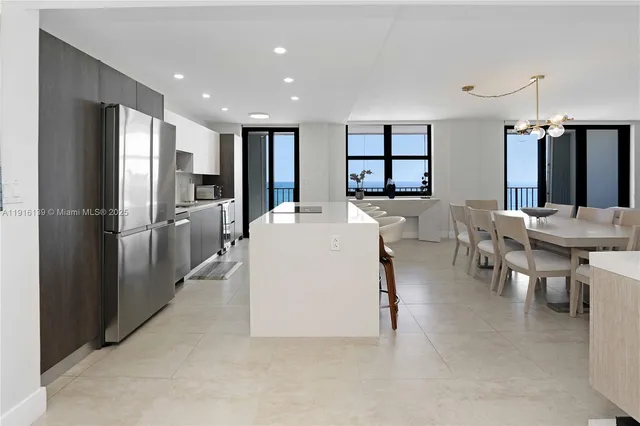 a large kitchen with a table and chairs