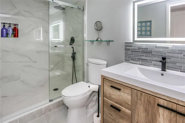 a bedroom with a bed window and couch