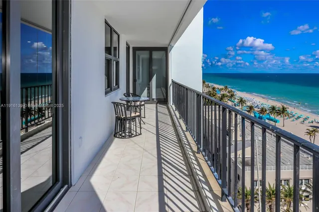 a view of swimming pool with a table and chairs