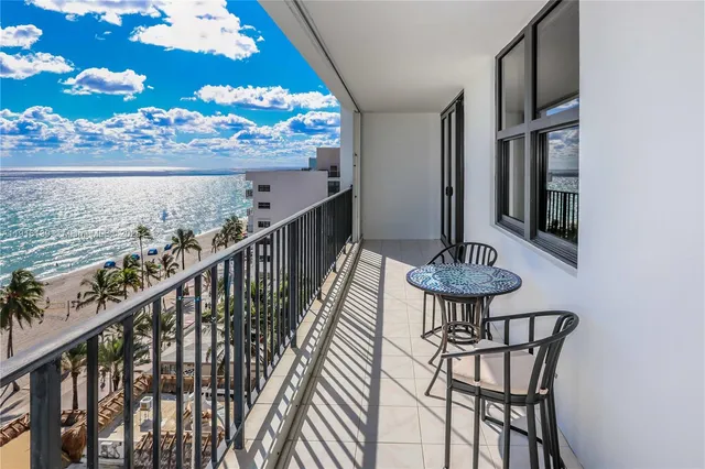 a view of balcony and wooden floor